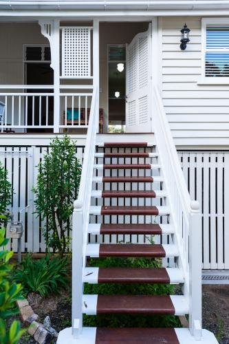 stairs on the front veranda of a Queenslander home