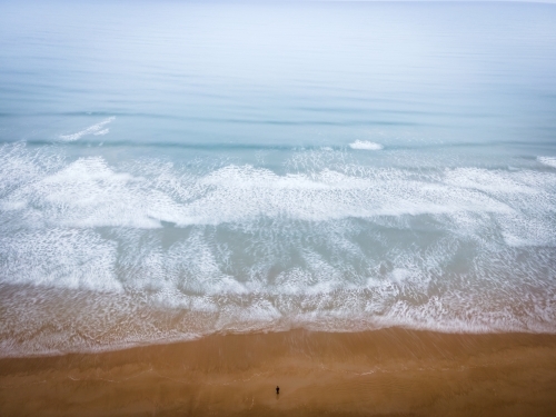 Standing alone on a misty beach - Aerial Perspective