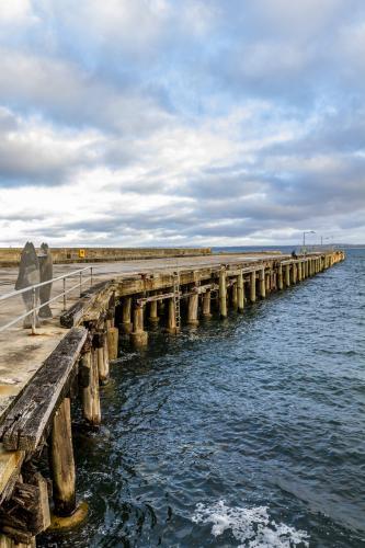 Stanley Wharf reaching into the ocean - Australian Stock Image