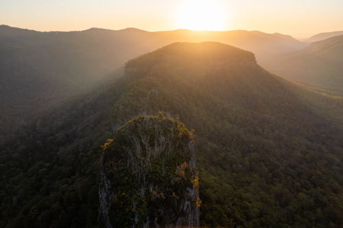 Steep rocky mountain landscape at sunset - Australian Stock Image