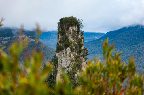 steep rocky pinnacle in mountain landscape - Australian Stock Image