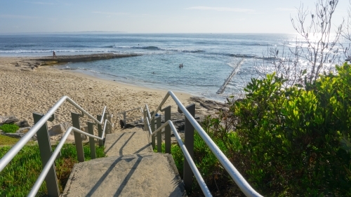 Steps and handrails leading down to beach and Oak Park ocean pool
