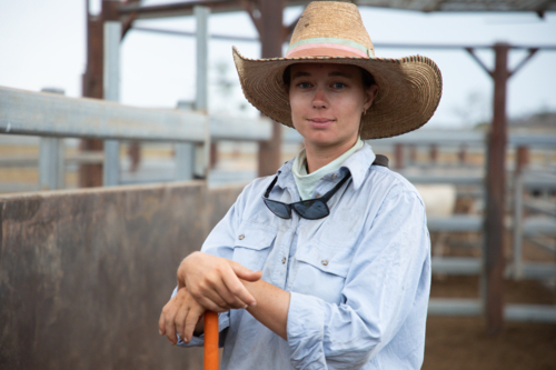 Stock woman standing in cattle yards - Australian Stock Image