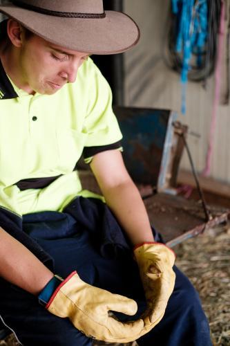 Stockman Seated in a Farm Shed - Australian Stock Image