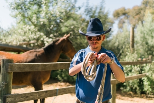 Stockman Winding a Rope - Australian Stock Image
