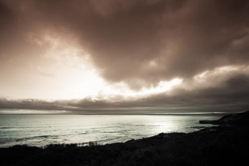Storm clouds gathering over a pristine beach - Australian Stock Image
