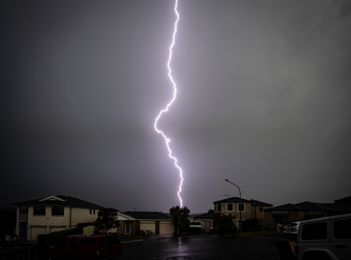 storm in suburbs lightning strike down the centre - Australian Stock Image
