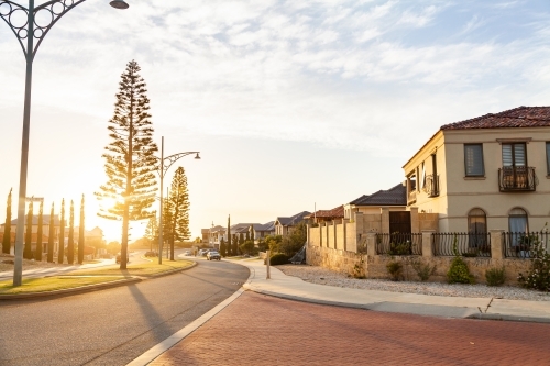 Street scene of houses near the coast at sunset in Iluka Perth - Australian Stock Image