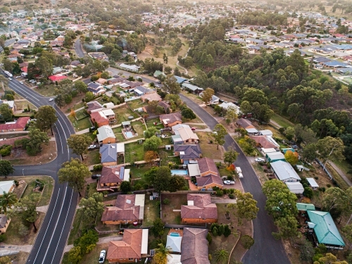 Streets and houses in Singleton Heights at dusk from drone - Australian Stock Image