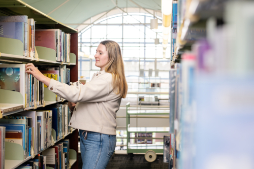 student in library - Australian Stock Image