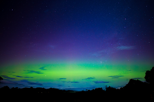 stunning aurora display with green and purple lights - Australian Stock Image
