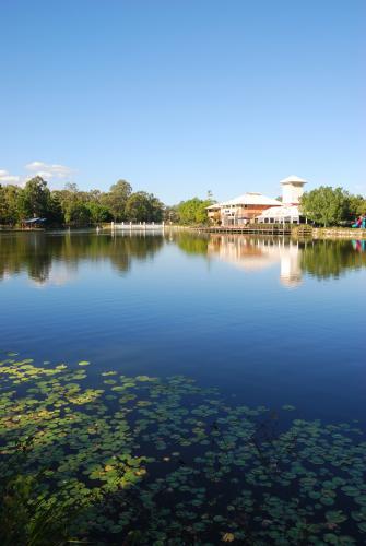 Suburb with shops and cafes by the lake portrait. - Australian Stock Image