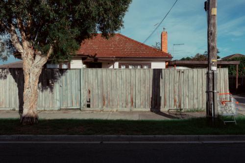 Suburban street corner with shopping trolley