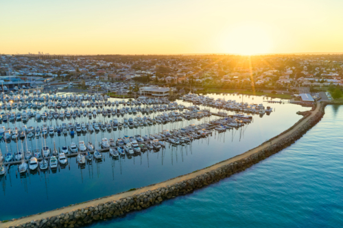 Sun rising over a marina in Fremantle, Western Australia - Australian Stock Image