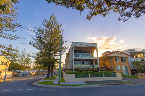 Sun setting behind seaside homes along Marine Parade at Miami on the Gold Coast - Australian Stock Image