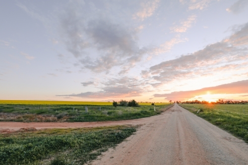 sun setting on country road in Central Victoria, Australia. Late afternoon in Australia. Landscape - Australian Stock Image
