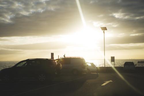 Sun setting over beach carpark - Australian Stock Image