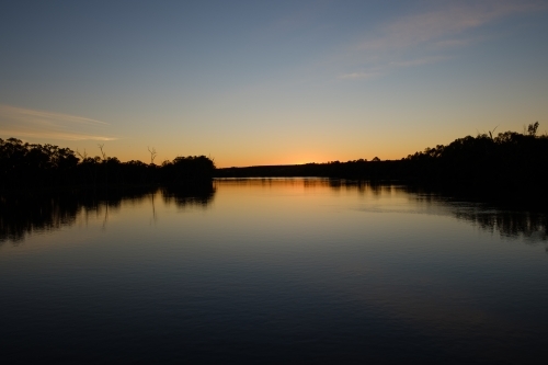Sun setting over the River Murray in Victoria with calm reflections