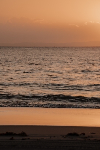Sun setting over the water at Moreton Bay - Australian Stock Image
