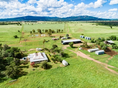 Sunlit farm homestead and sheds - Australian Stock Image