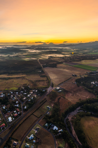 Sunrise hot air balloon ride over Mareeba in the Atherton Tablelands - Australian Stock Image
