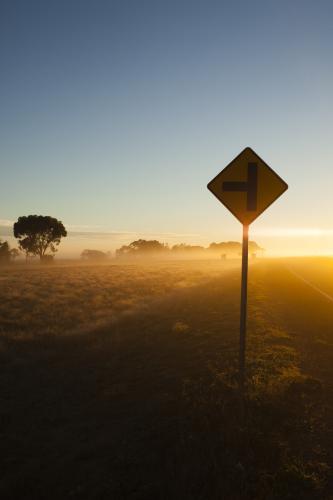 Sunrise in regional highway with Sign in the foreground