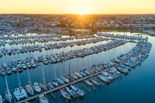 Sunrise on the horizon over a marina in Fremantle, Western Australia - Australian Stock Image