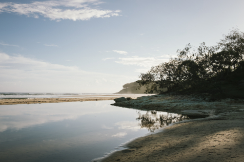 Sunrise over beach on Stradbroke Island in Queensland Australia - Australian Stock Image
