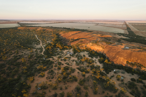 Sunrise over Elachbutting Rock in the eastern Wheatbelt of Western Australia - Australian Stock Image