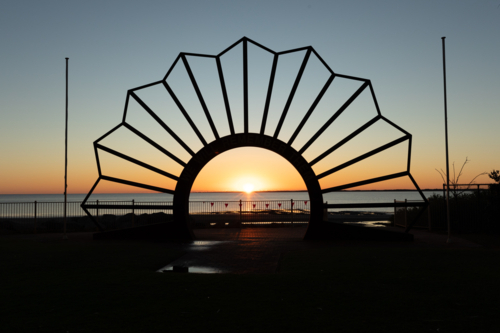Sunrise through the Anzac memorial, Onslow, WA - Australian Stock Image