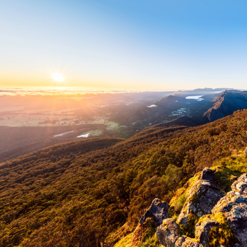 sunrise view above Halls Gap while viewed from Boroka Lookout, Grampians, Victoria - Australian Stock Image