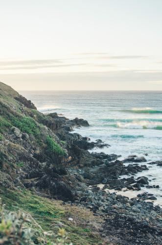 Sunrising over ocean and cliffs