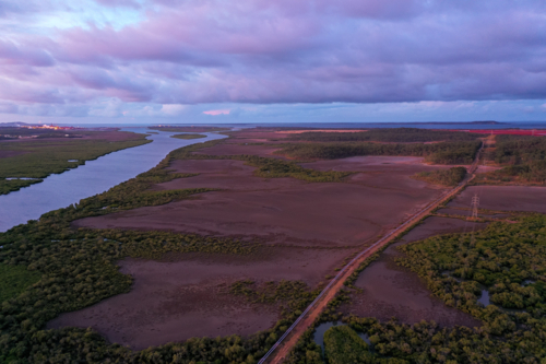 Sunset aerial view of coastal wetland estuary - Australian Stock Image