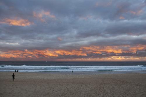 Sunset at beach with colourful sky - Australian Stock Image