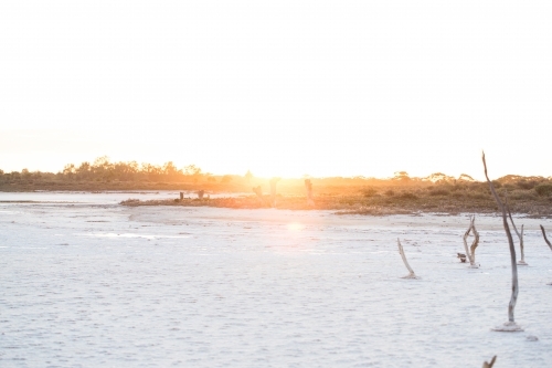 Sunset glow over the pristine waters of Kakadu National Park. - Australian Stock Image