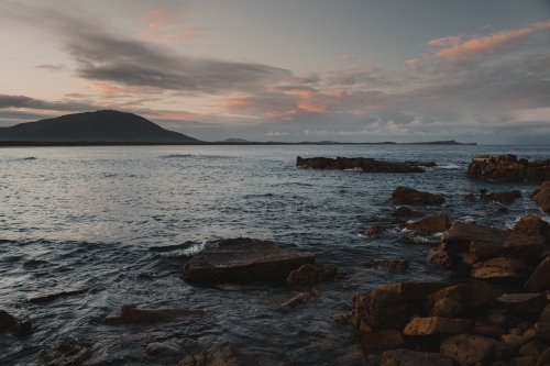 Sunset landscape of the rocky coast at Diamond Head Beach, NSW. - Australian Stock Image