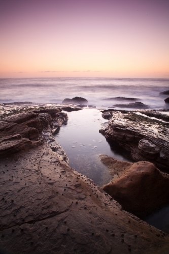 Sunset on a rock platform - Australian Stock Image
