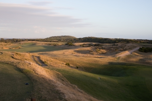 Sunset on golf course next to beach - Australian Stock Image