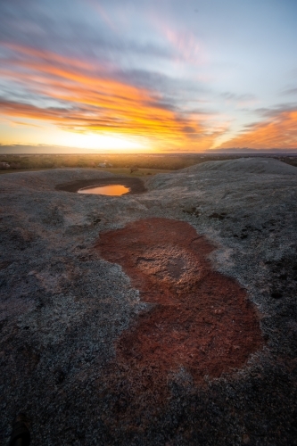 Sunset over a Rocky Rural Paddock - Australian Stock Image