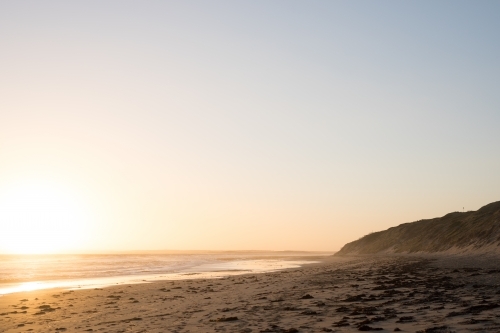 Sunset over beach with large sky - Australian Stock Image