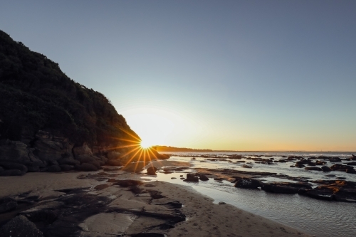 Sunset over rocky shelf at Norah Head, NSW Australia - Australian Stock Image