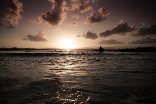 Sunset surf at Byron Bay - Australian Stock Image
