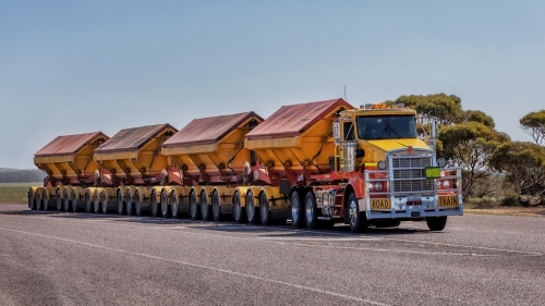 Super Quad Road Train (with 4 trailers) driving on the highway