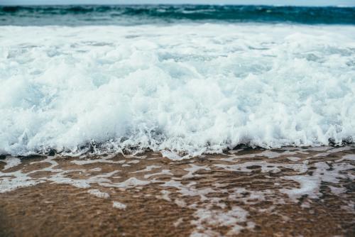 Surf rolling in - Australian Stock Image