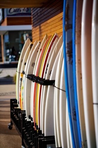 Surfboards lined up outside a surf shop - Australian Stock Image
