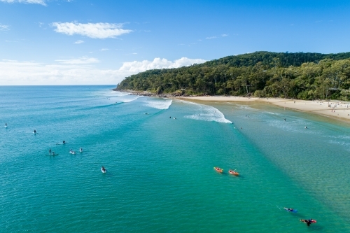 Surfers and waves at Noosa. - Australian Stock Image
