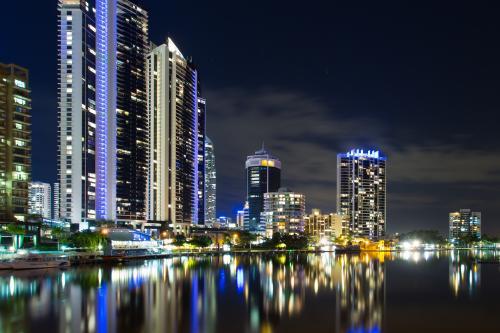 Surfers Paradise city with lights reflected in water at night