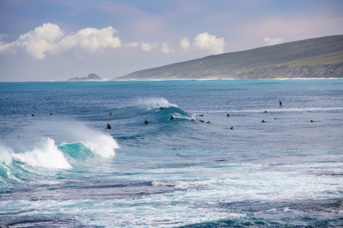Surfers waiting on waves in Yallingup - Australian Stock Image
