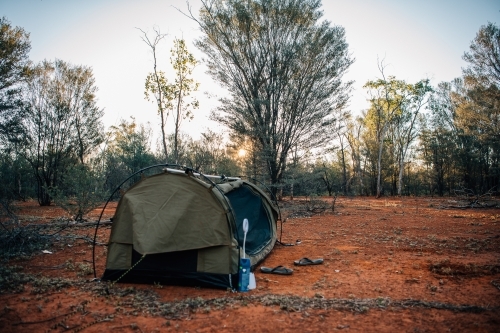 Swag setup in the red outback bush land - Australian Stock Image