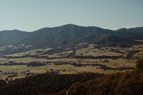 Sweeping valley views with mountains in the background near Tawonga. - Australian Stock Image